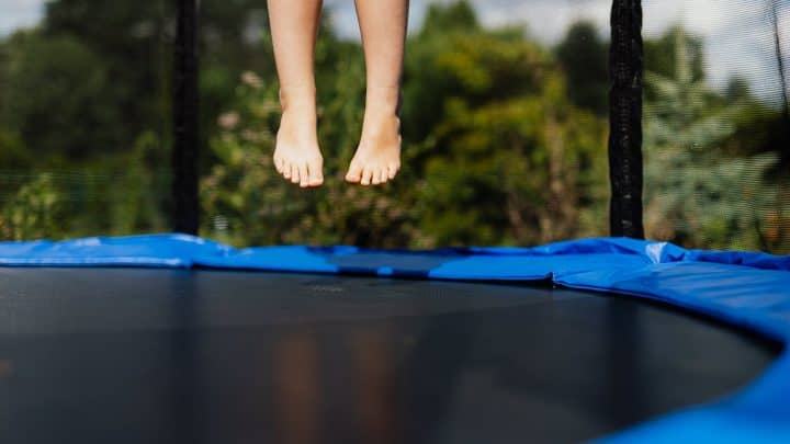 person jumping on trampoline